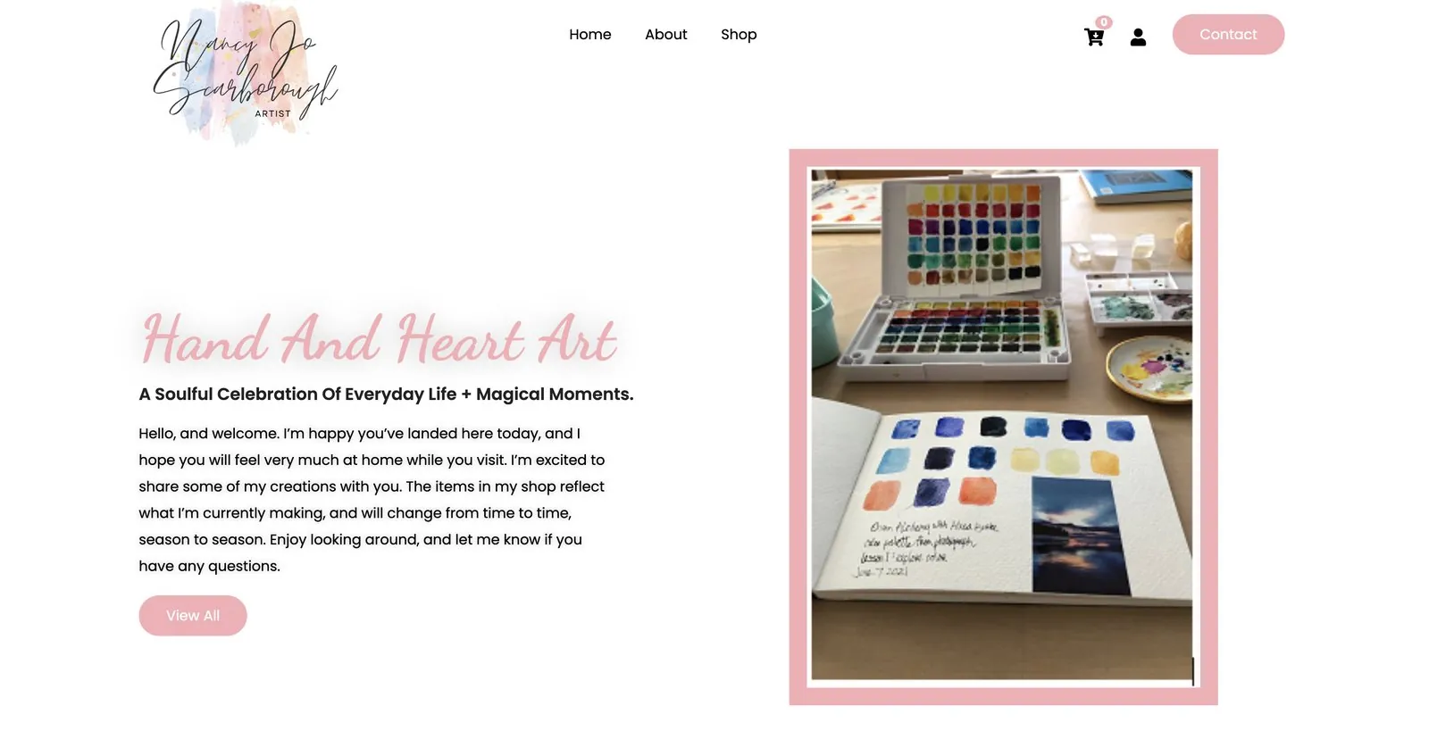 Homepage: Hand and Heart Art, a personal welcome from Nancy and a photo of her watercolor palette